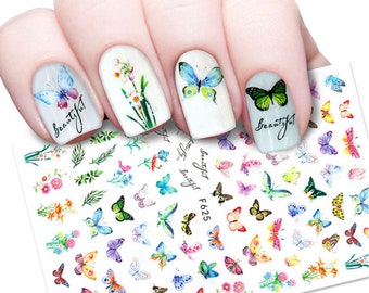 May include: Nail art stickers with a white background and colorful butterflies, flowers, and leaves. The stickers are labeled "Beautiful" and "F625".