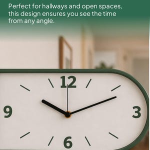 May include: A dual-sided wall clock with a white face and black hands and numerals. The clock has a green oval frame and the numbers 3, 6, 9, and 12 are visible. The text "DUAL-SIDED VISIBILITY" is at the top.