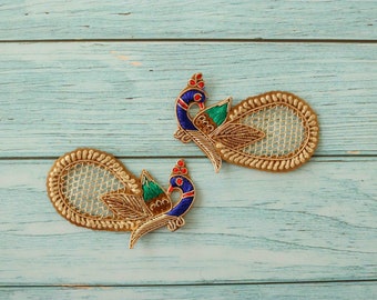 May include: Two gold peacock embroidery patches with blue, green, and red accents. The patches have a mesh design in the center.