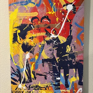 May include: Abstract painting with a vibrant color palette of red, yellow, blue, and purple. The artwork features stylized figures and splattered paint effects. The text "BOBBY HILL" is visible at the bottom left.