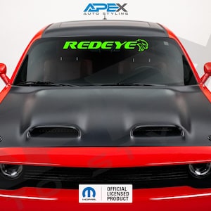 May include: A red Dodge Challenger with a black hood and a green "REDEYE" windshield banner. The banner includes a green graphic of a demon. The car has a black hood with two air intakes and the official Mopar licensed product logo.