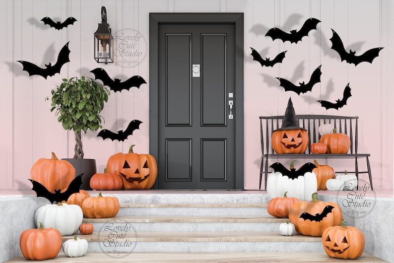 May include: A pink and white house with a black door decorated for Halloween. There are black bats hanging from the eaves and pumpkins on the porch. The pumpkins are orange and white and some have carved faces. There is a black bench with a pumpkin on it and a witch's hat on top. The text "Lovely Cute Studio" is visible on the image.