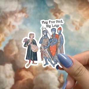 May include: A sticker featuring medieval illustrations. The sticker shows a musician with a lute and three armored figures with weapons. Text at the top reads "Play Free Bird, My Leige."
