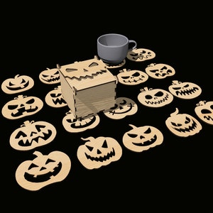 May include: A set of 15 wooden pumpkin-shaped coasters with carved jack-o'-lantern faces. A wooden box with a carved jack-o'-lantern face sits in the center of the coasters. A gray ceramic mug sits on top of the box.