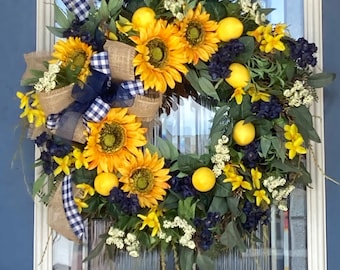 Corona de girasol y limón con acento azul y arpillera.