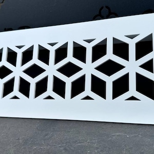 May include: White rectangular vent cover with a geometric pattern of repeating diamond shapes. The vent cover is made of a hard material and has a smooth surface.