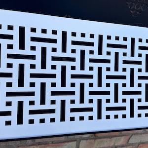 May include: White metal vent cover with a black geometric pattern. The pattern is made up of horizontal and vertical lines that create a woven effect.