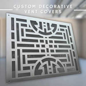 May include: A silver metal vent cover with a geometric design featuring circles and lines. The cover is designed to be decorative and functional.