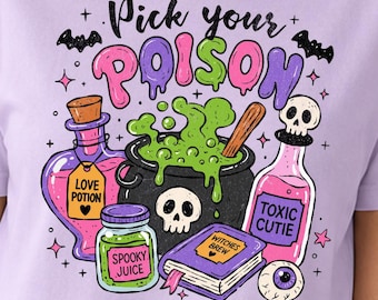 May include: A light purple t-shirt featuring a graphic print with the text Pick your POISON. The design includes a black cauldron with green bubbling liquid, a skull, a book labeled Witches Brew, and bottles labeled Love Potion and Toxic Cutie.