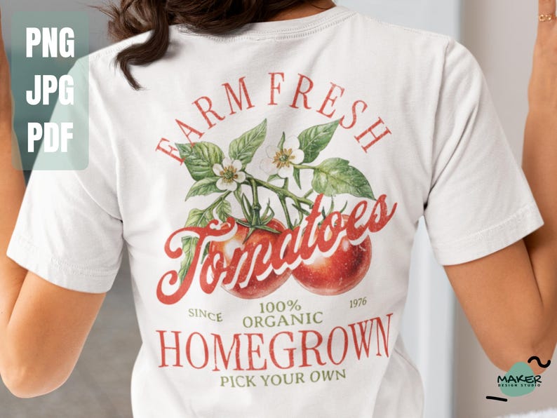 May include: White t-shirt with a red and green graphic design that says "Farm Fresh Tomatoes Since 1976 100% Organic Homegrown Pick Your Own".