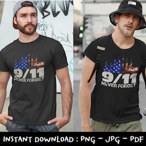 May include: Black t-shirt with a distressed graphic commemorating 9/11. The design features a stylized American flag, the date "9/11," and the words "NEVER FORGET." The shirt is a classic crew neck style.
