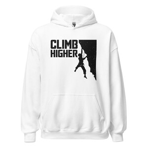May include: White hoodie with a black silhouette of a person rock climbing with the text "CLIMB HIGHER" printed on the front.