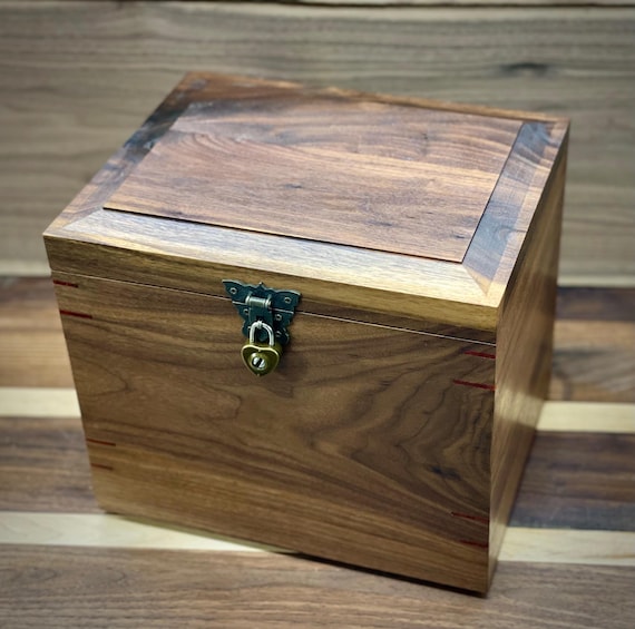 Cremation urn with memory compartment