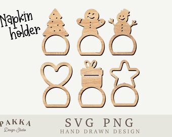 May include: Set of six wooden napkin rings with Christmas themes. The designs include a Christmas tree, a gingerbread man, a snowman, a heart, a gift box, and a star.