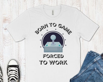 May include: White t-shirt with a black and gray joystick graphic and the text "Born to Game Forced to Work".