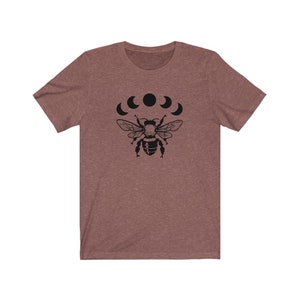May include: A heather gray t-shirt with a black bee and crescent moon design.