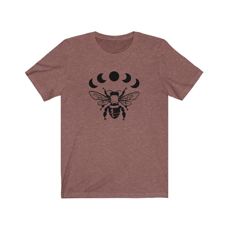 May include: A heather gray t-shirt with a black bee and crescent moon design.