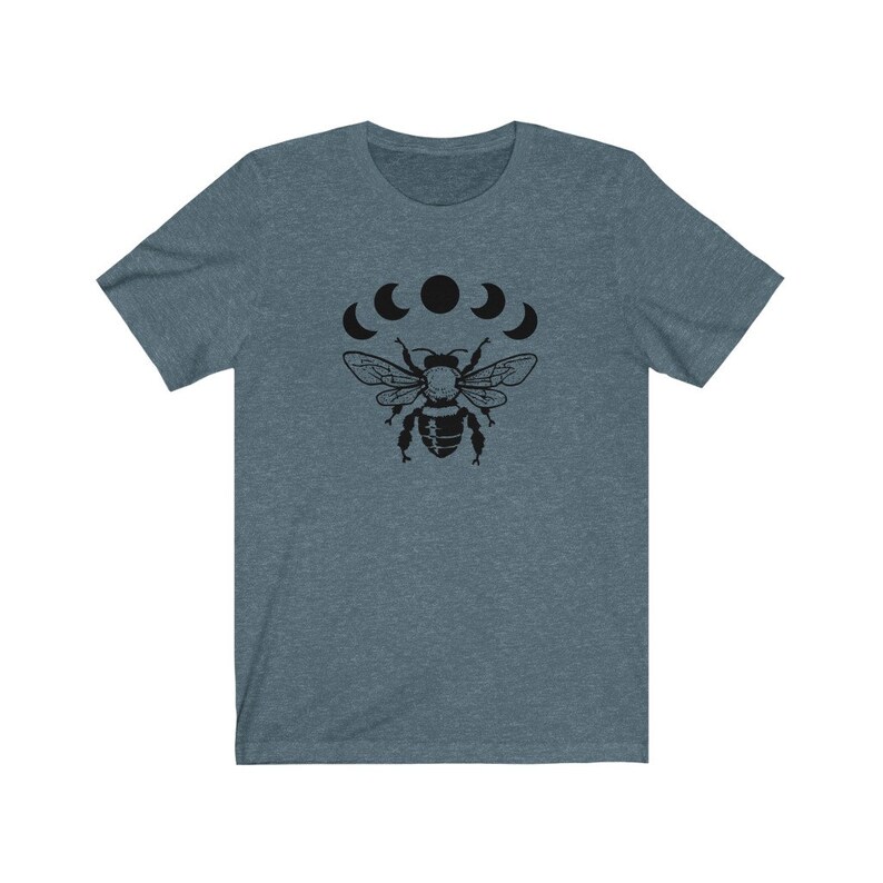 May include: A dark blue t-shirt with a black bee and five crescent moons graphic print.