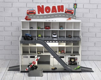 Toy car garage with interactive toy car wash, motion detection activated  and inscription with chid's name in white