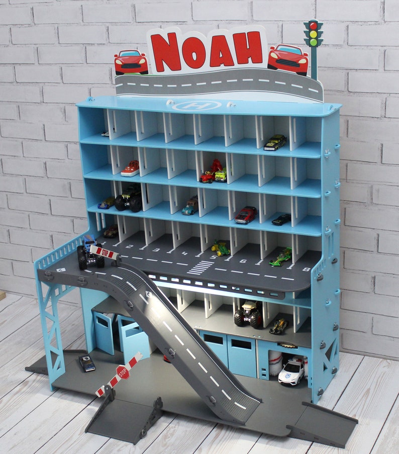 Toy car garage in light blue with light and inscription image 3