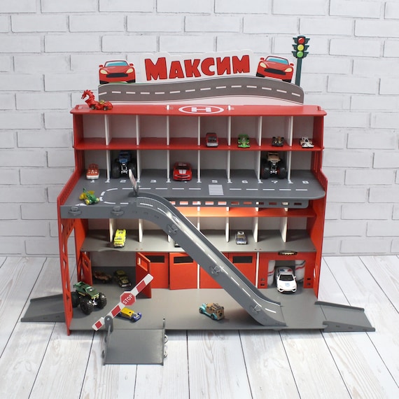 Toy car garage with interactive toy car wash, ilumination and sign