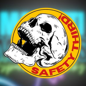 May include: A yellow circular sticker featuring a black and white skull graphic and the text "Safety Third" in red lettering.