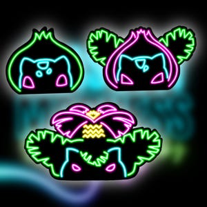 May include: Three neon signs with cartoon animal faces. Each sign has a different color scheme: green, pink, and purple. The signs are set against a dark background.