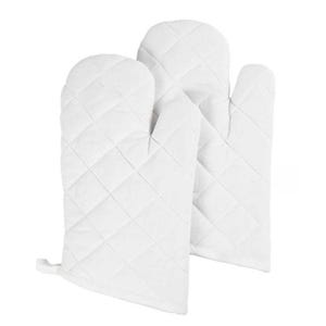 May include: Two white quilted oven mitts. The mitts are made of a soft, quilted fabric and have a diamond pattern. Each mitt has a loop for hanging. Kitchen and cooking supplies.