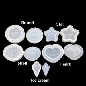 Könnte beinhalten: Ein Set mit 10 transparenten Silikonformen zum Basteln. Die Formen sind in Form einer runden Schüssel, eines Sterns, einer Muschel, eines Herzens und eines Eisbechers. Die Formen sind perfekt für die Herstellung von Kunstharz-Bastelarbeiten, Seife und anderen DIY-Projekten.
