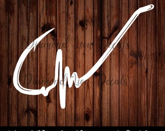 May include: White vinyl decal of a fishing hook with a heartbeat line. The decal is on a brown wood background. Vinyl Decal - Permanent Outdoor.
