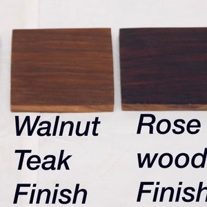 May include: Four wood samples showing different finishes: natural teak, walnut teak, rose wood, and black teak.