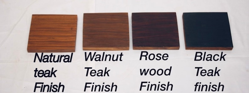 May include: Four wood samples showing different finishes: natural teak, walnut teak, rose wood, and black teak.