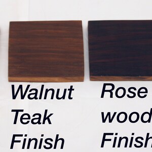 May include: Four wood samples showing different finishes: natural teak, walnut teak, rose wood, and black teak.