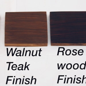May include: Four wood samples showing different finishes: natural teak, walnut teak, rose wood, and black teak.