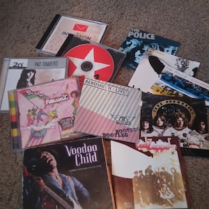 Rock CD&#39;s Hendrix Crue Aerosmith Inserts