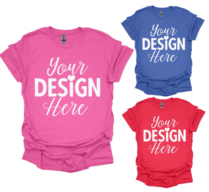May include: Three t-shirts in different colors: pink, blue, and red. Each shirt has the text "Your Design Here" printed on the front in white.