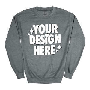 Może przedstawiać: Szara bluza z kapturem z napisem "YOUR DESIGN HERE" w kolorze białym. Tekst jest otoczony małymi białymi gwiazdkami i sercami.
