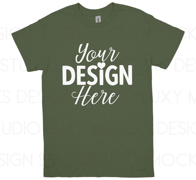 May include: Olive green t-shirt with the text "Your DESIGN Here" in white, a heart symbol is placed above the letter "I". The t-shirt is a crew neck style.