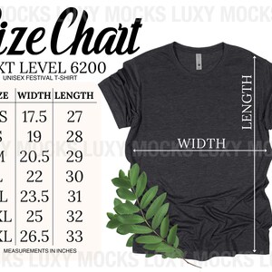 K&ouml;nnte beinhalten: Gr&ouml;&szlig;entabelle f&uuml;r ein Unisex-Festival-T-Shirt, die die Ma&szlig;e in Zoll f&uuml;r Breite und L&auml;nge angibt. Die Tabelle umfasst die Gr&ouml;&szlig;en XS, S, M, L, XL, 2XL und 3XL. Neben der Tabelle ist ein dunkelgraues T-Shirt abgebildet.