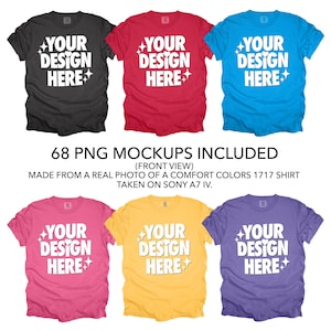 May include: Six different color t-shirts with the text "YOUR DESIGN HERE" printed on the front. The t-shirts are laid flat on a white background.