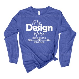 May include: A royal blue long-sleeved t-shirt with a white graphic that says "My Design Here" with an arrow and the text "MOCKUP HEAVEN CO. EST. ON EARTH".