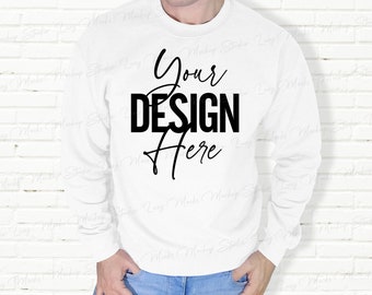 May include: White long-sleeved sweatshirt with the text "Your Design Here" printed on the front.