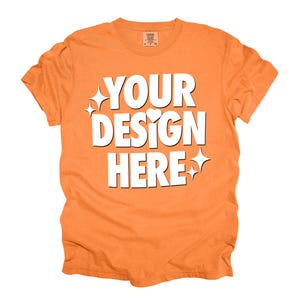 Pode incluir: Camiseta laranja com o texto "YOUR DESIGN HERE" em branco.