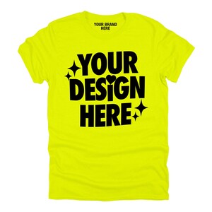 May include: A bright yellow t-shirt with black text that says "YOUR BRAND HERE" and "YOUR DESIGN HERE" with a small heart and stars.