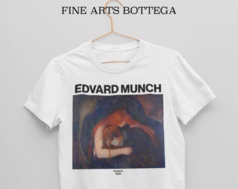 May include: White t-shirt featuring a print of Edvard Munch's "Vampire" painting. The painting shows a woman with red hair embracing another person in a dark setting. The text "Edvard Munch" and "Vampire 1895" is printed below the painting.