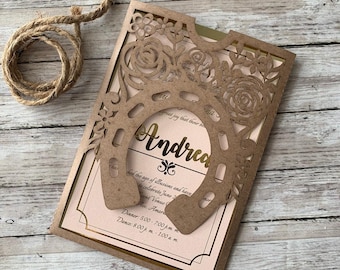 May include: A brown laser cut invitation with a gold horseshoe design and the name "Andrea" in gold lettering. The invitation is for a celebration with dinner and dancing.