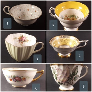 Puede incluir: Seis tazas de té diferentes con varios patrones florales y detalles dorados. Las tazas de té son blancas con ribetes dorados y presentan diferentes diseños florales.