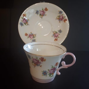 Vintage Rare Aynsley with cabbage rose and pink handle teacup and saucer