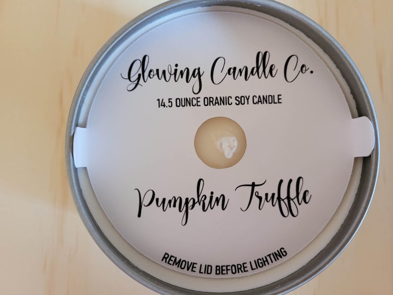 Photo featuring a sample of custom candle dust covers with mockup candle company name, candle ounces and type of wax, scent name Pumpkin Truffle and the standard remove lid before lighting text at the bottom. White cardstock black ink standard wick.