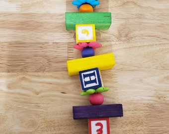 Parrot large sized block wood toy with plastic flowers and bell